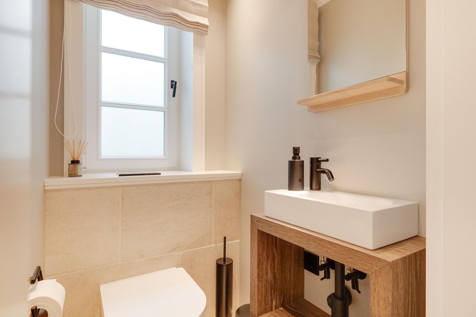 Bathroom with sink, mirror and window