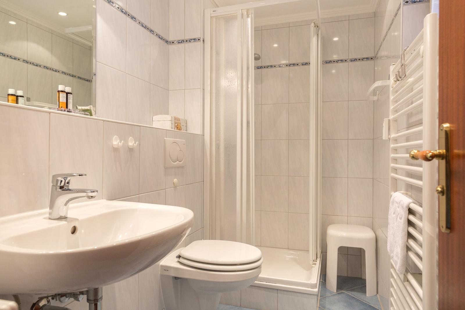 Bathroom with shower, sink and toilet