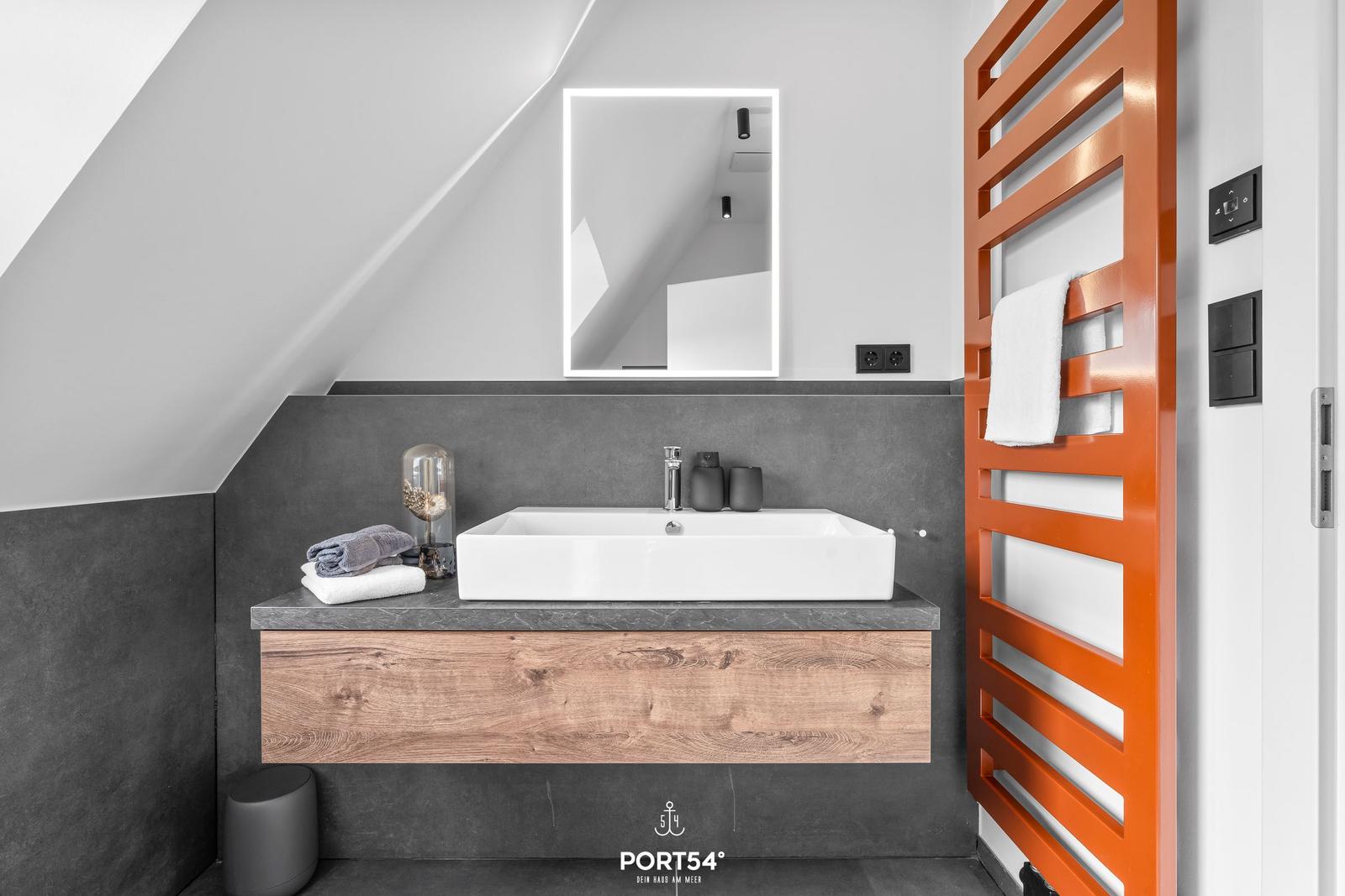 Bathroom with orange heater and sink