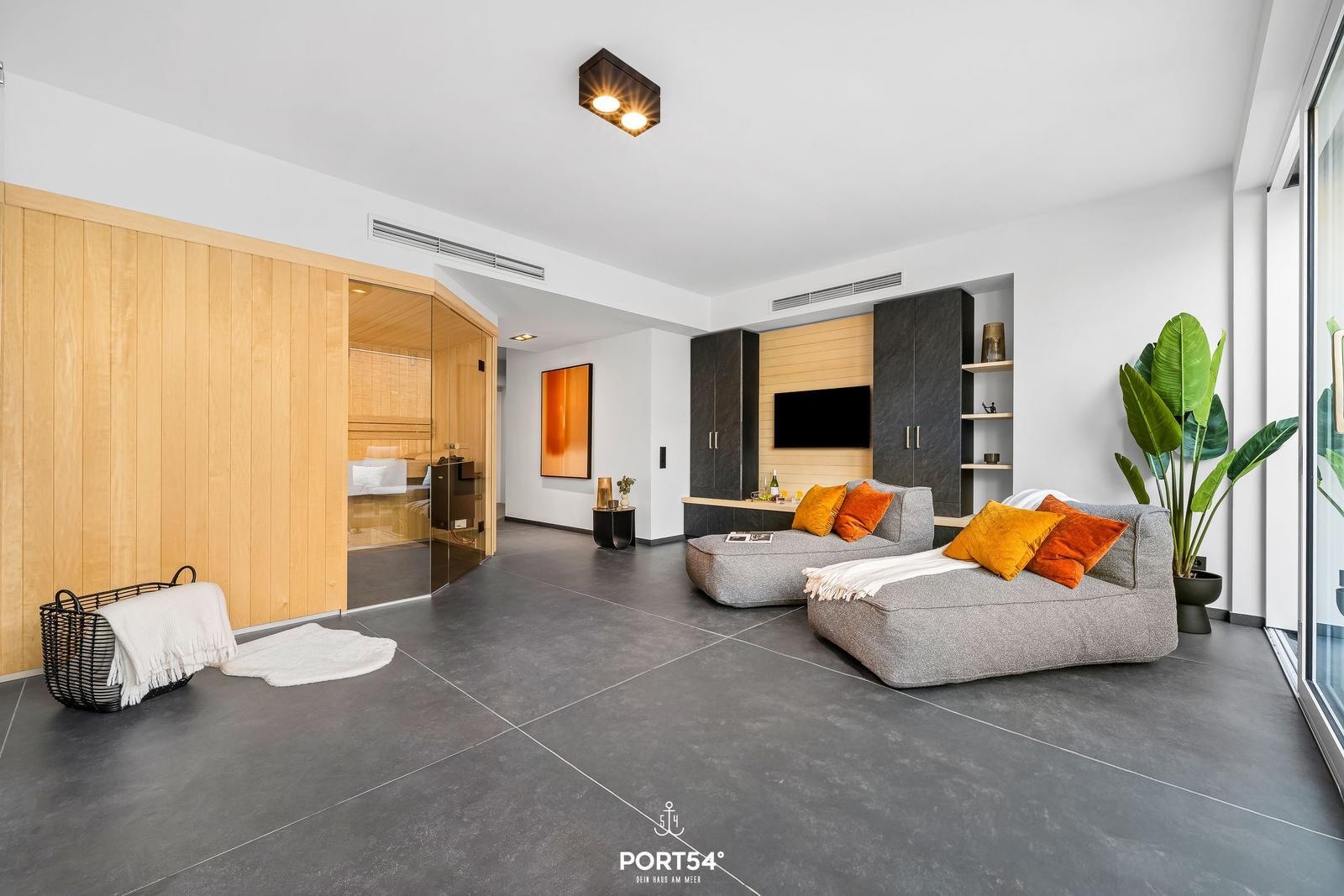 Living room with sofa, sauna, and plant