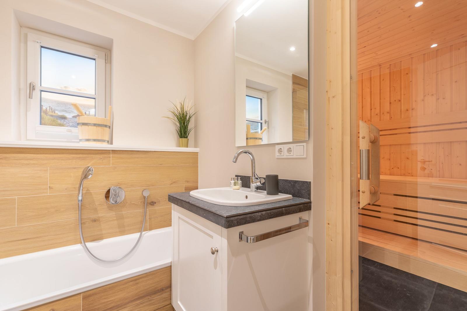 Bath with bathtub, mirror, and sauna