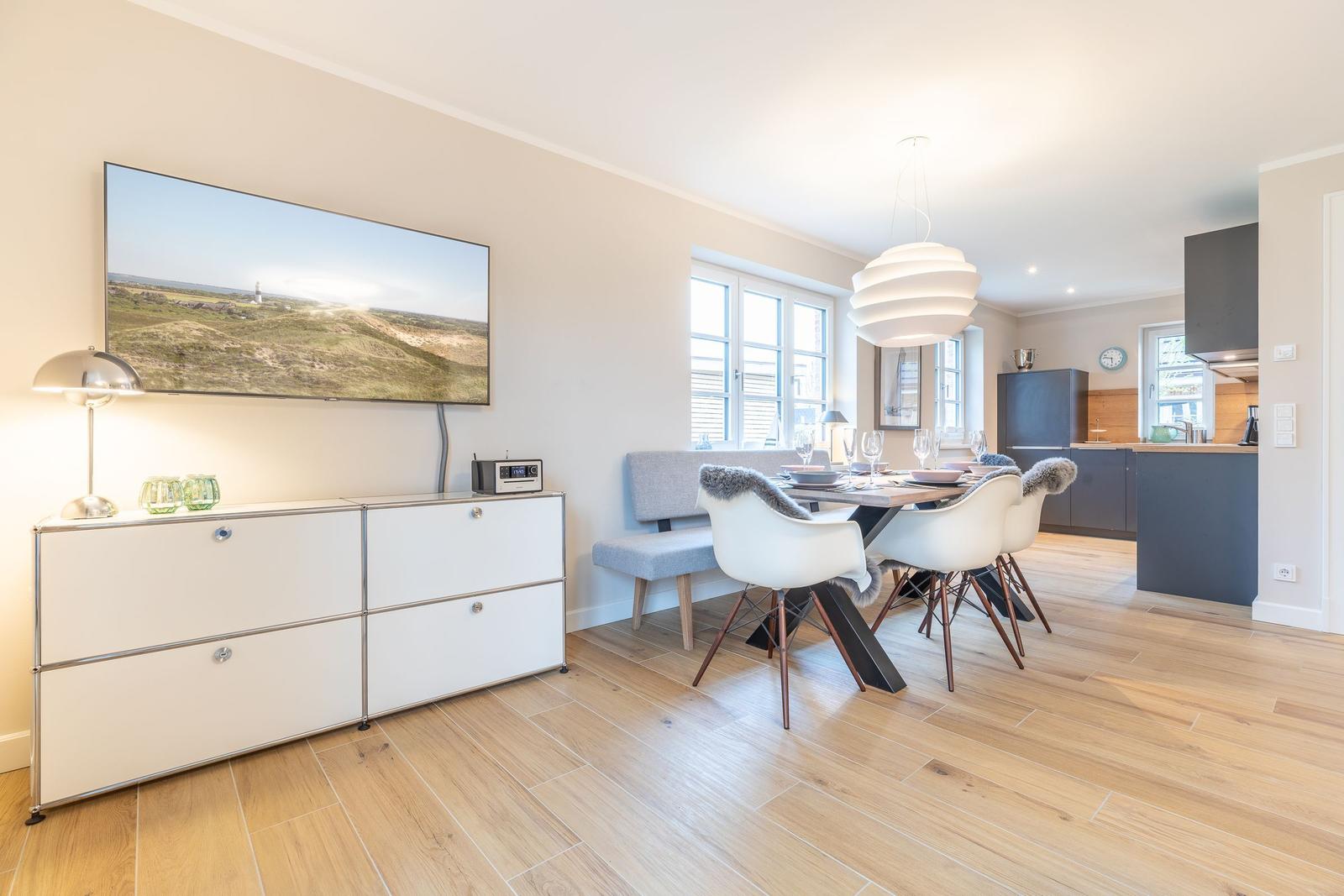 Dining room with table, chairs, and kitchen area