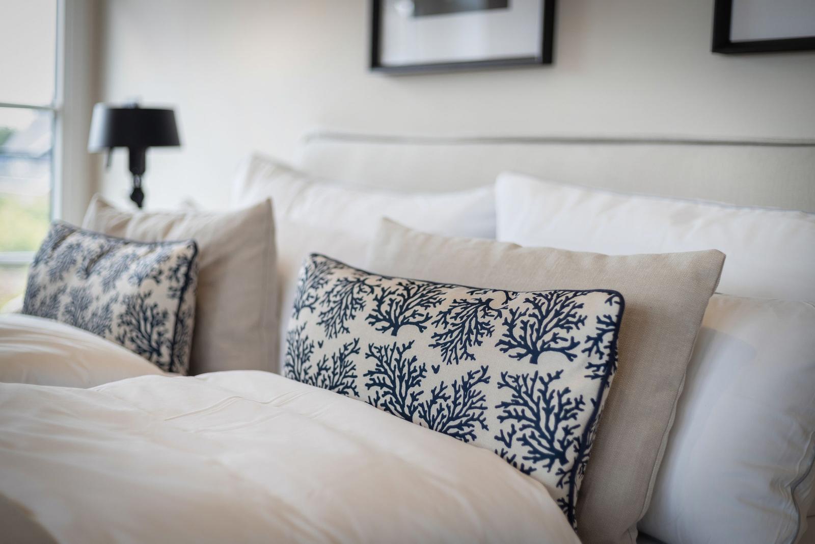 Bed head with pillows and duvet in neutral colors
