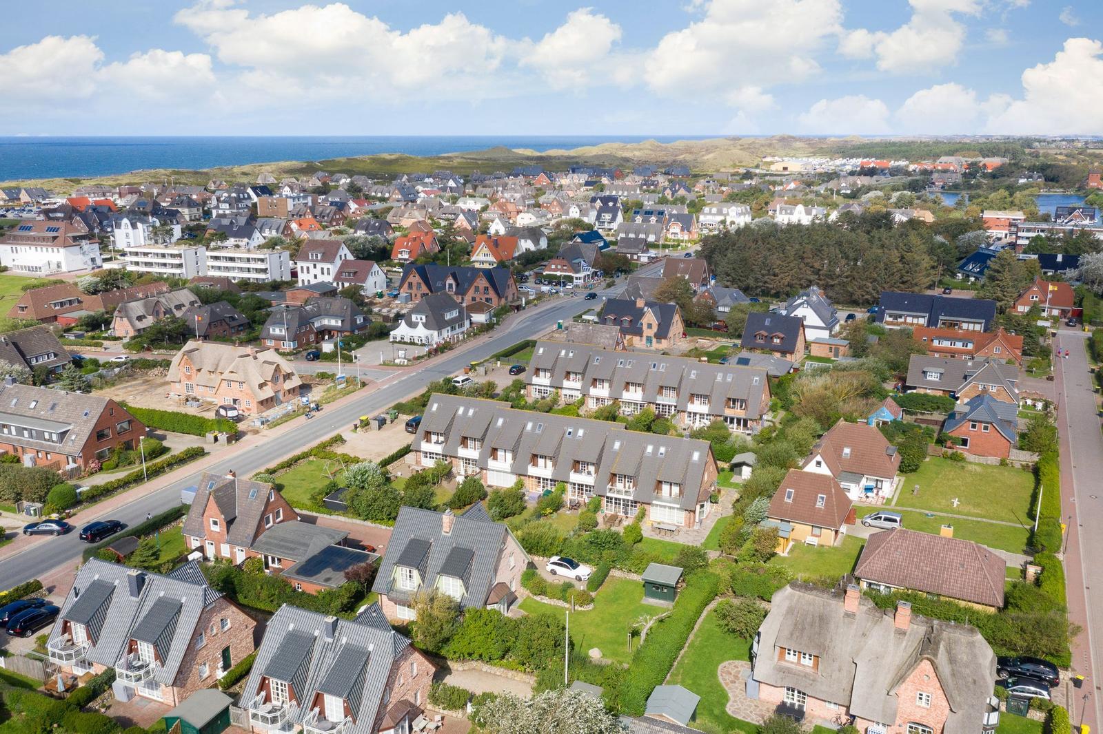 View of coastal town with houses and beach