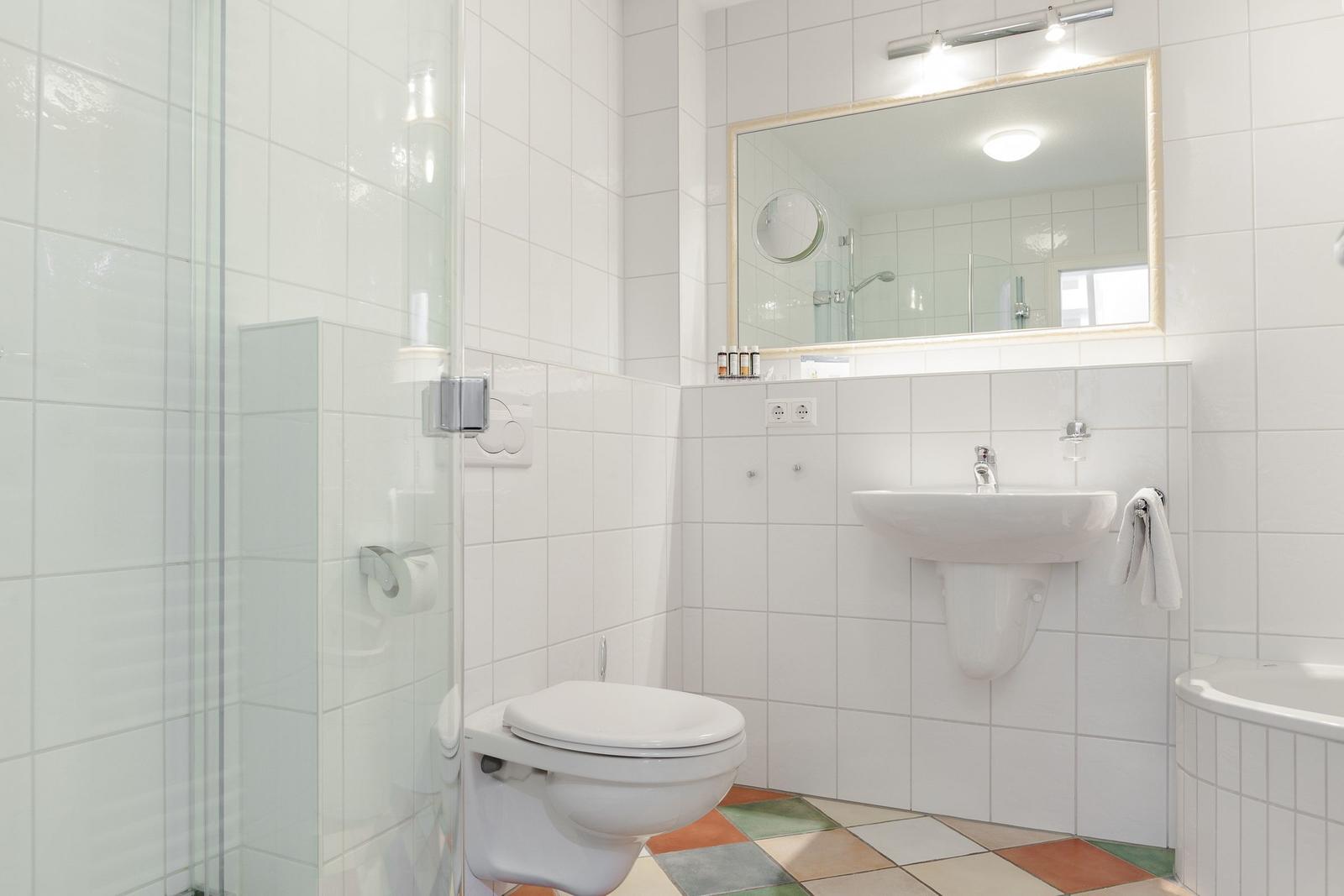 Bathroom with shower, toilet, sink, and bathtub.