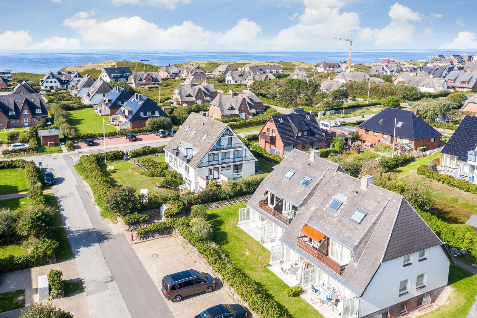 Houses with gardens and sea view
