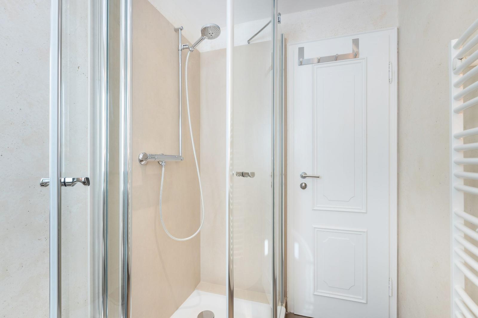 Shower cabin with shower head and door