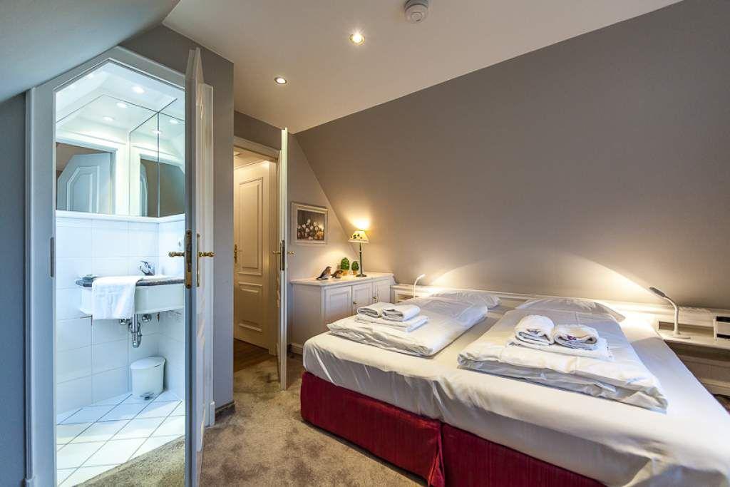 Bedroom with double bed and adjoining bathroom