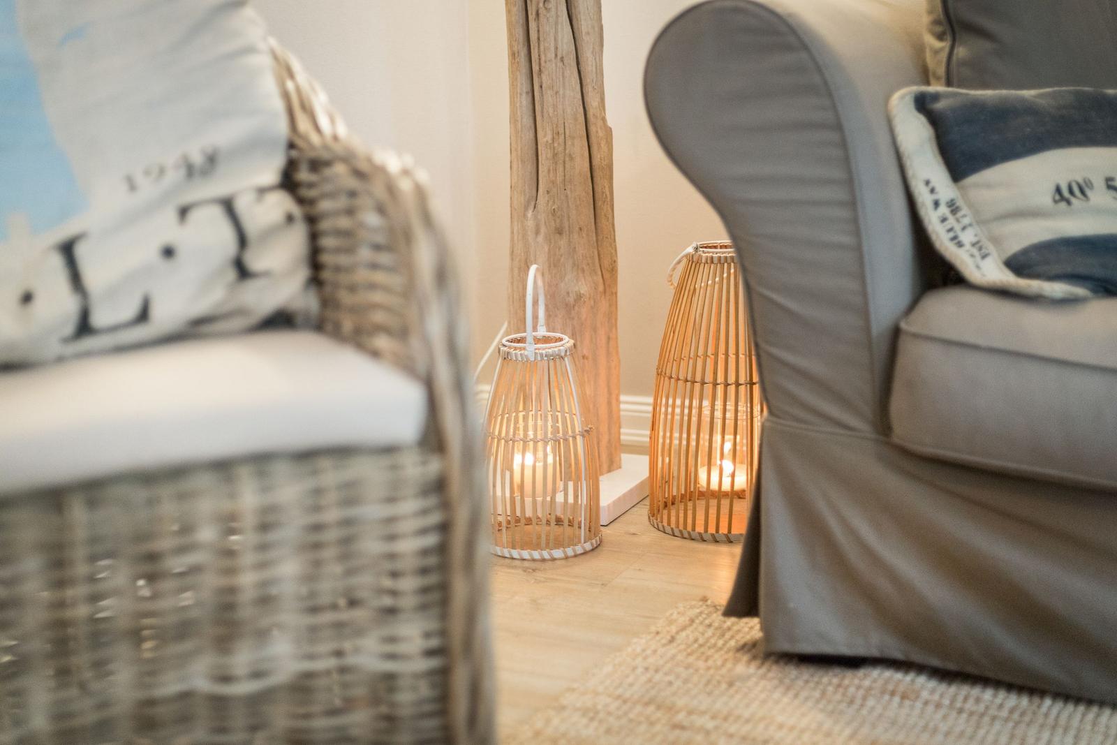 Living room with armchair, baskets, and wooden leg