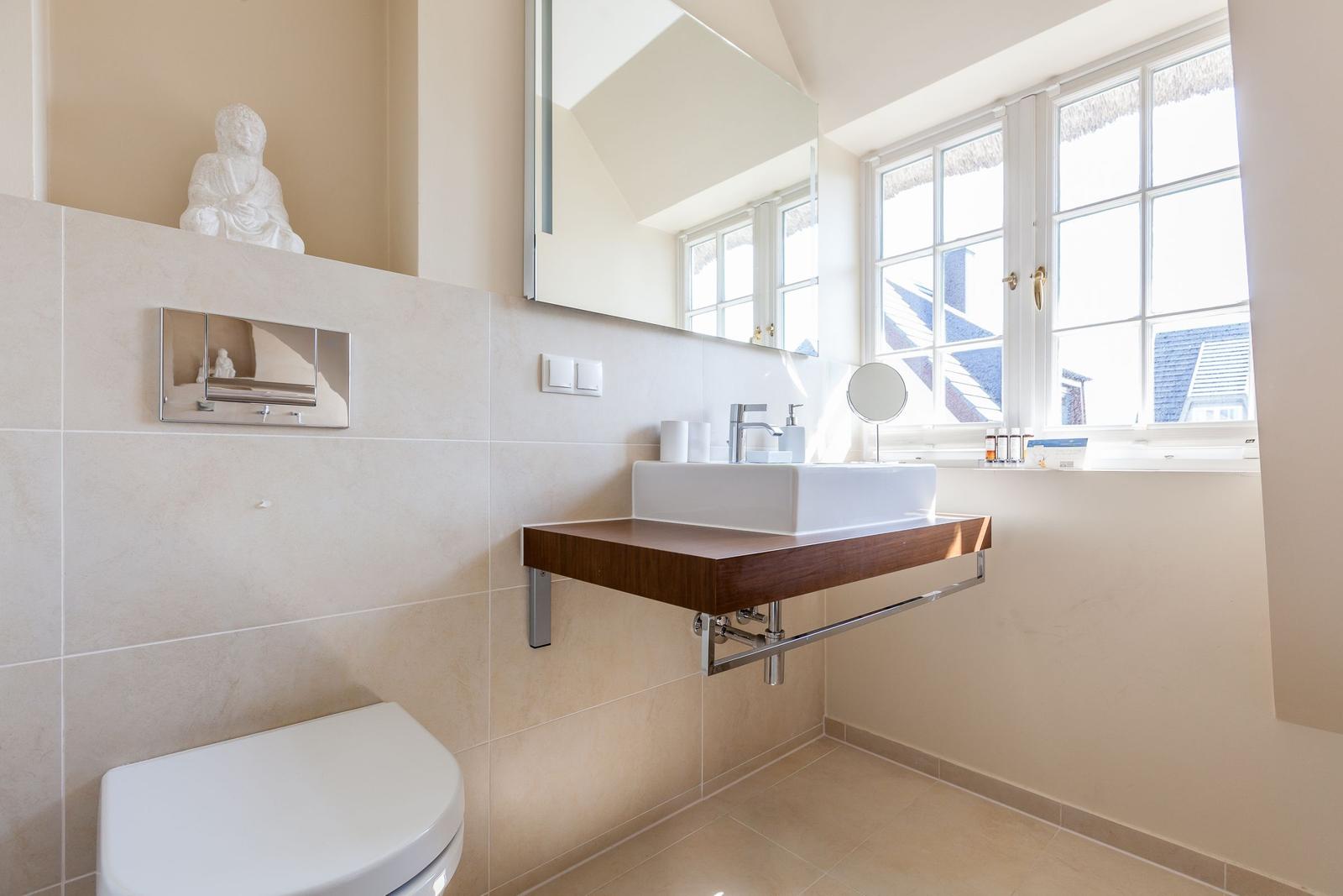 Bathroom with sink, mirror and window