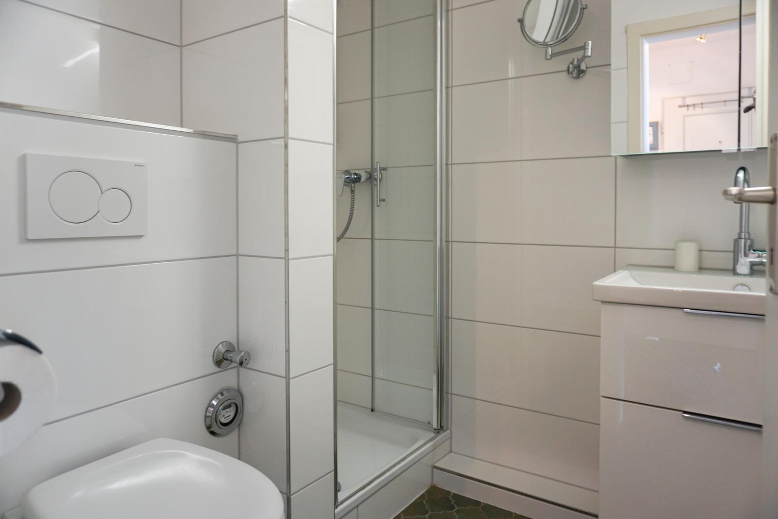 Bathroom with shower, sink and toilet