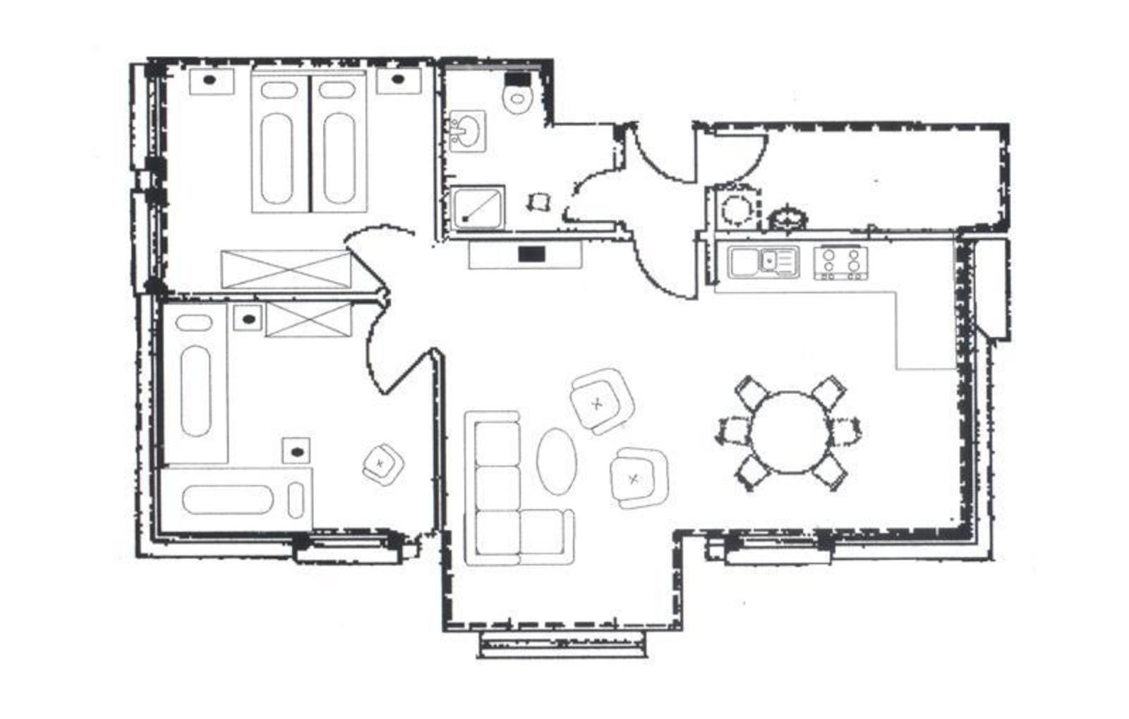 Dieses Apartment hat zwei Schlafzimmer, ein Bad, eine Küche und ein Wohnzimmer mit Essbereich.
