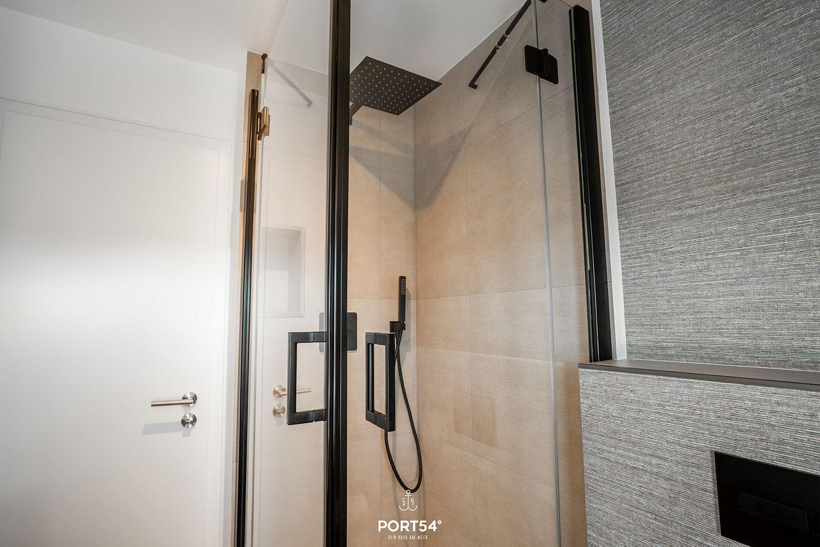 Shower with glass enclosure and showerhead