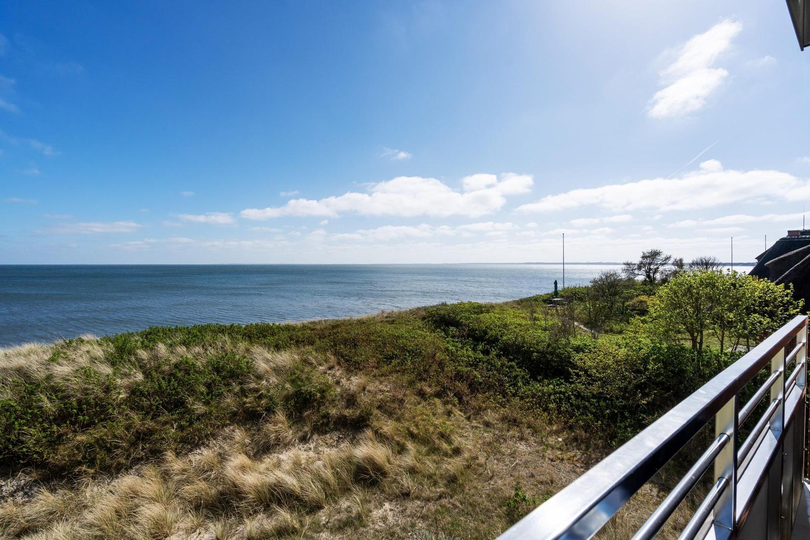 View of the sea from a terrace with railing