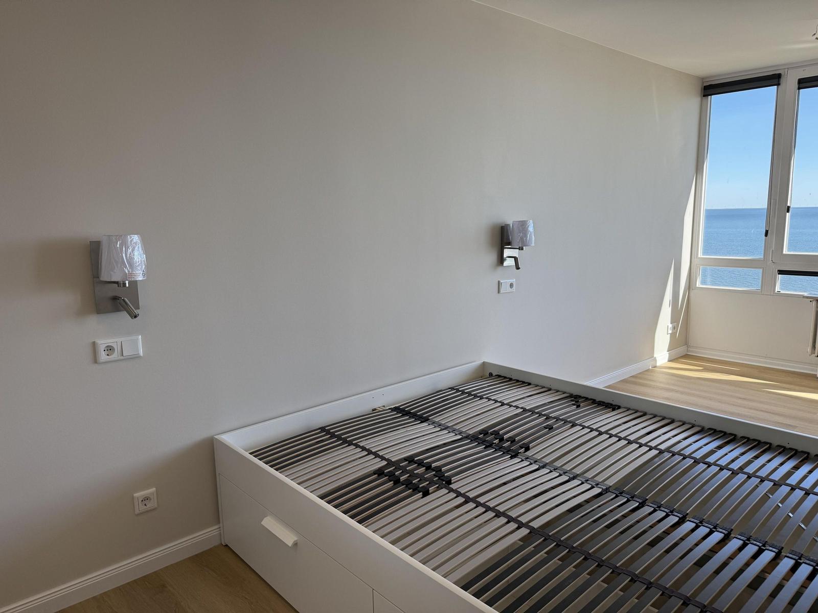 Bedroom with sea view and mattress frame