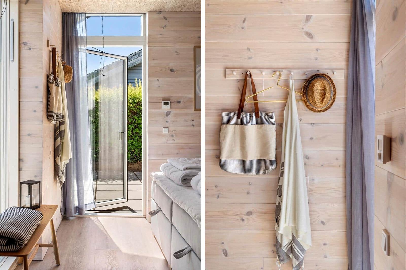 Wooden wall, bed, door to balcony, towel and bag hanging