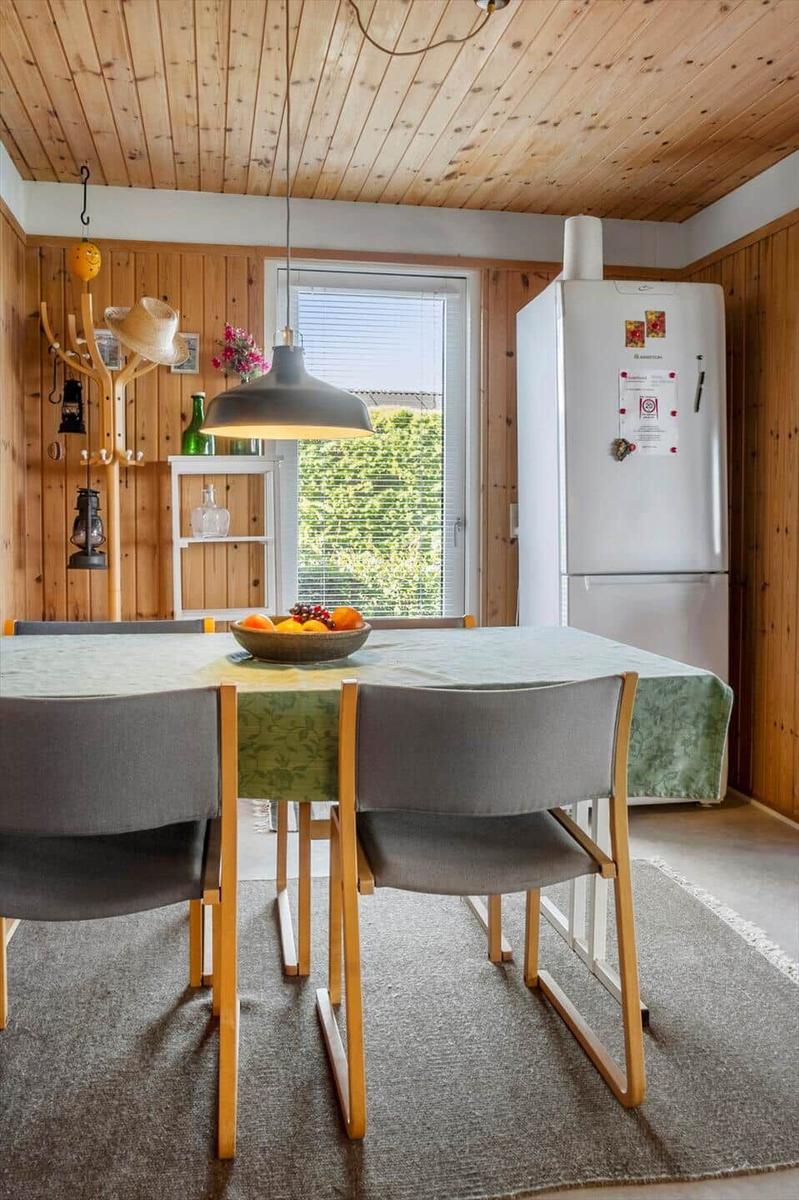 Dining area with table, chairs, and view of garden