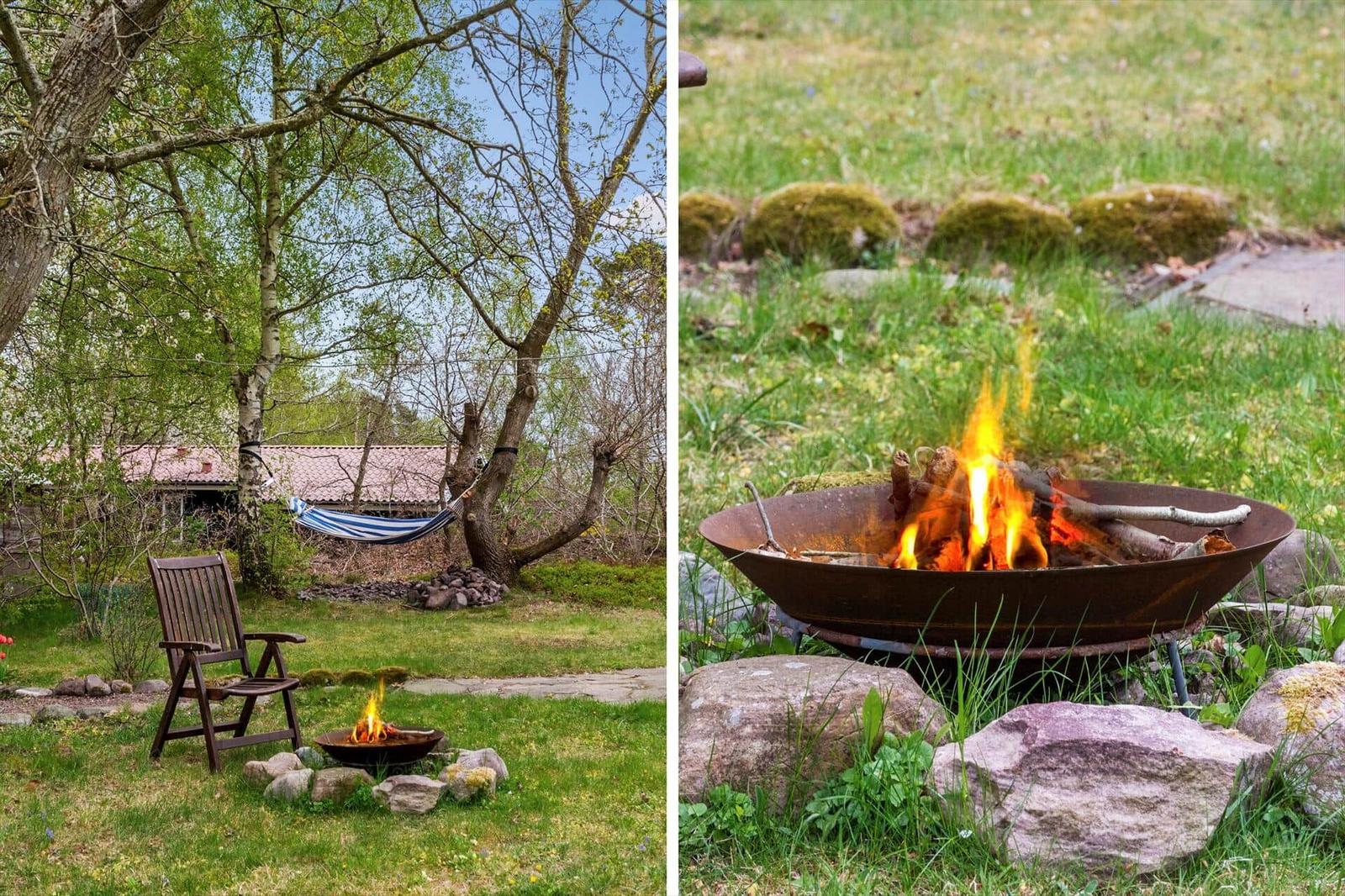 Fire pit in garden with chair and hammock under trees.