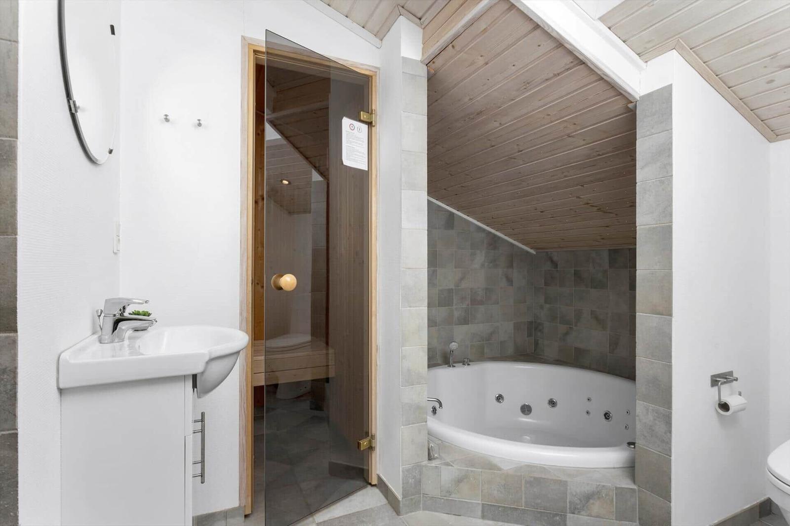 Bathroom with whirlpool, shower, and sink