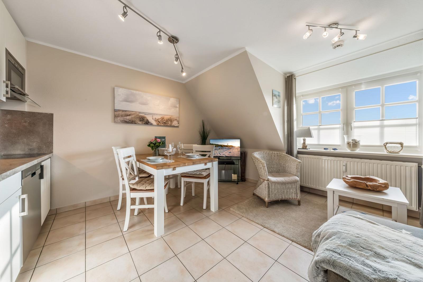 Living space with dining area, sleeping space, and windows with a view.