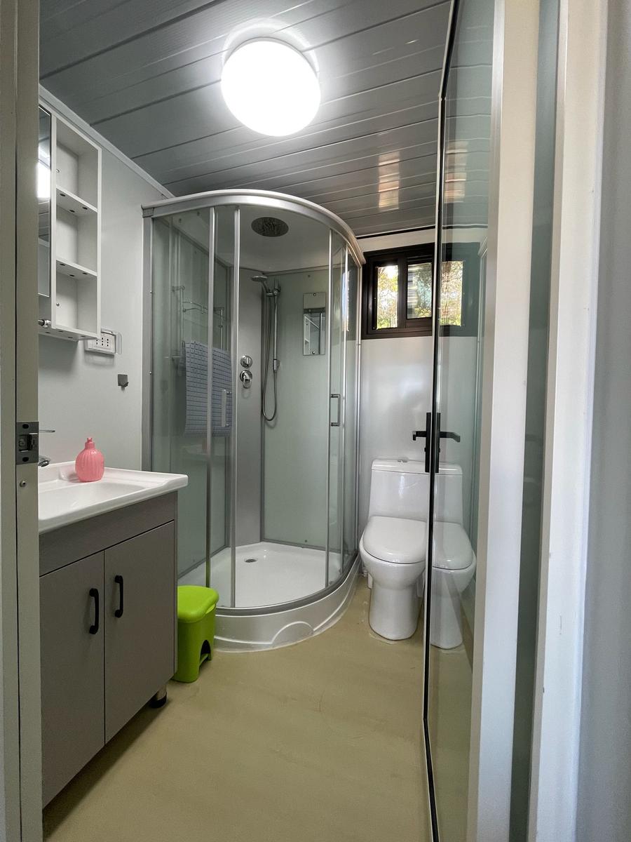 Bathroom with shower, toilet, and sink