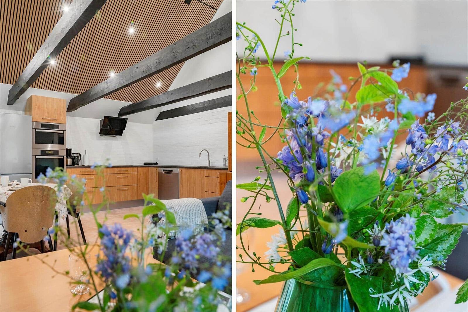 Kitchen with wooden beams and flower arrangement