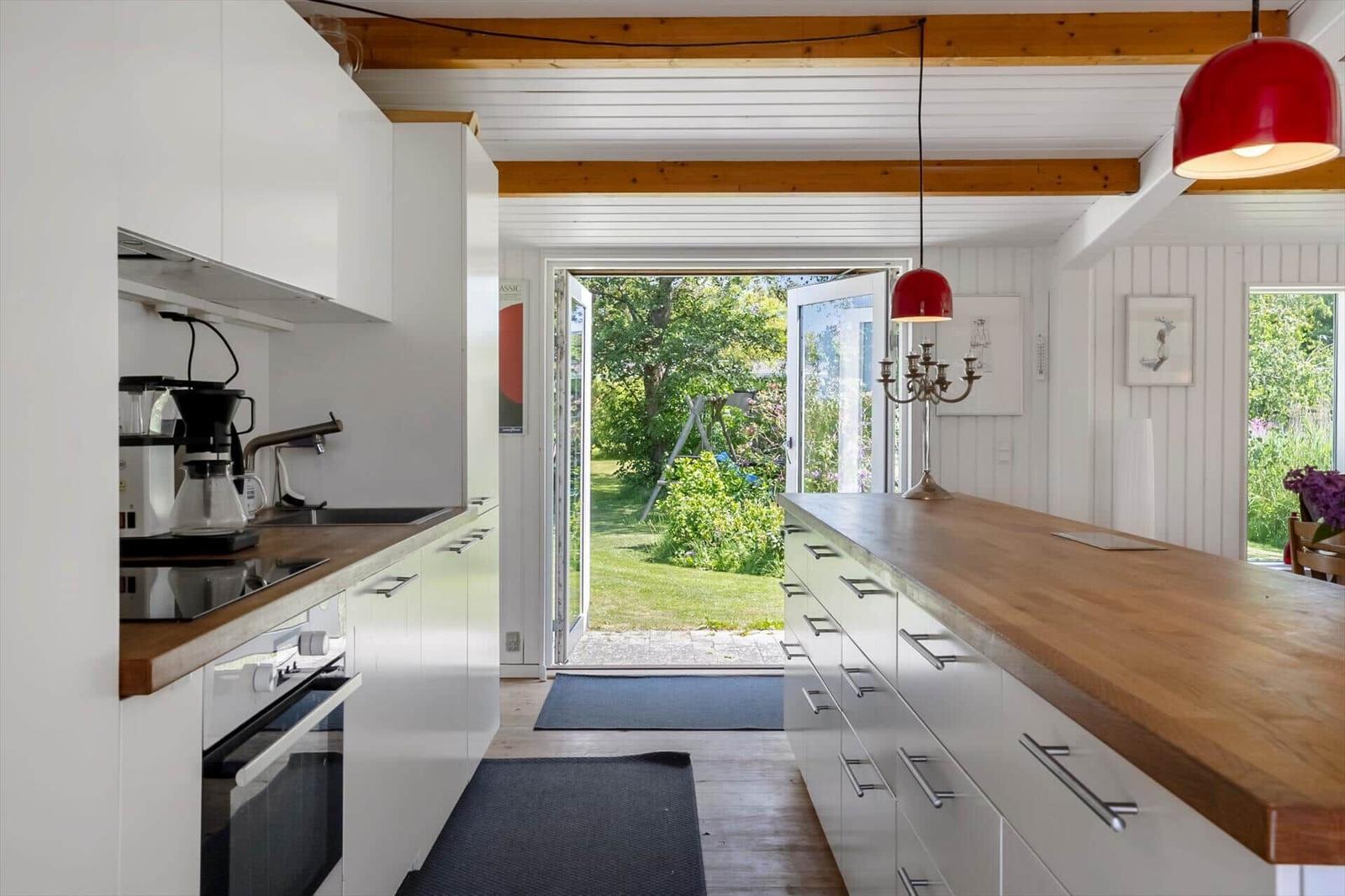 Kitchen with wooden countertop and view of the garden
