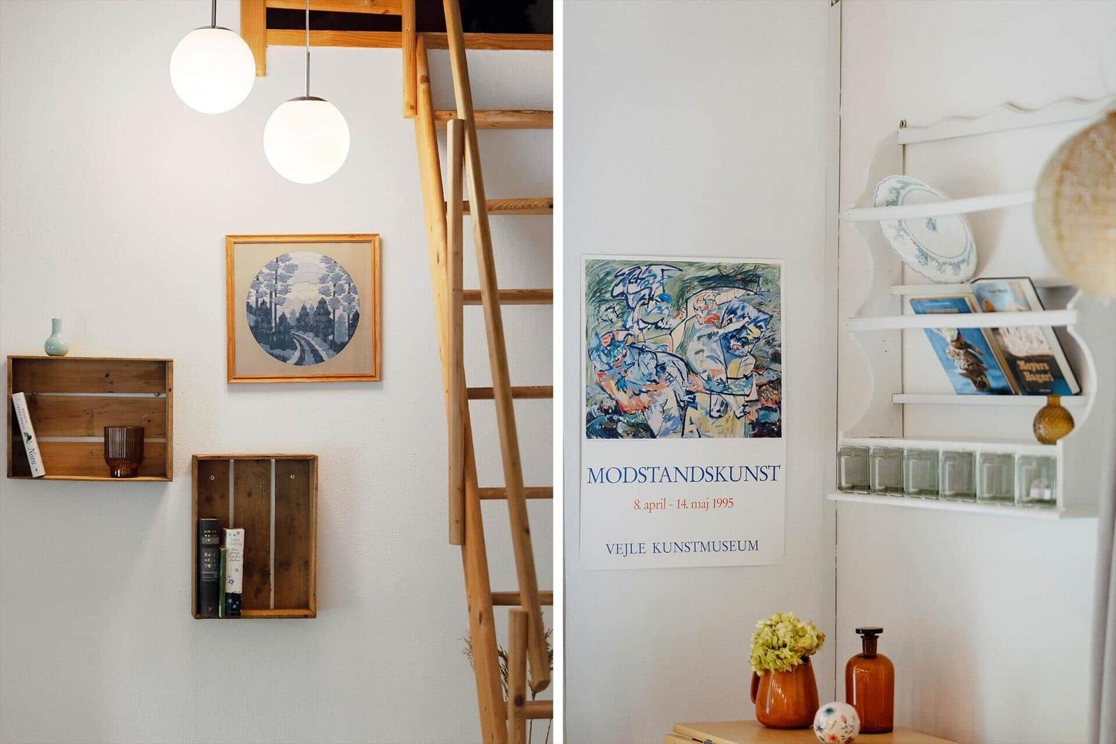 Living space with wooden ladder, wall art, and decorative shelves.