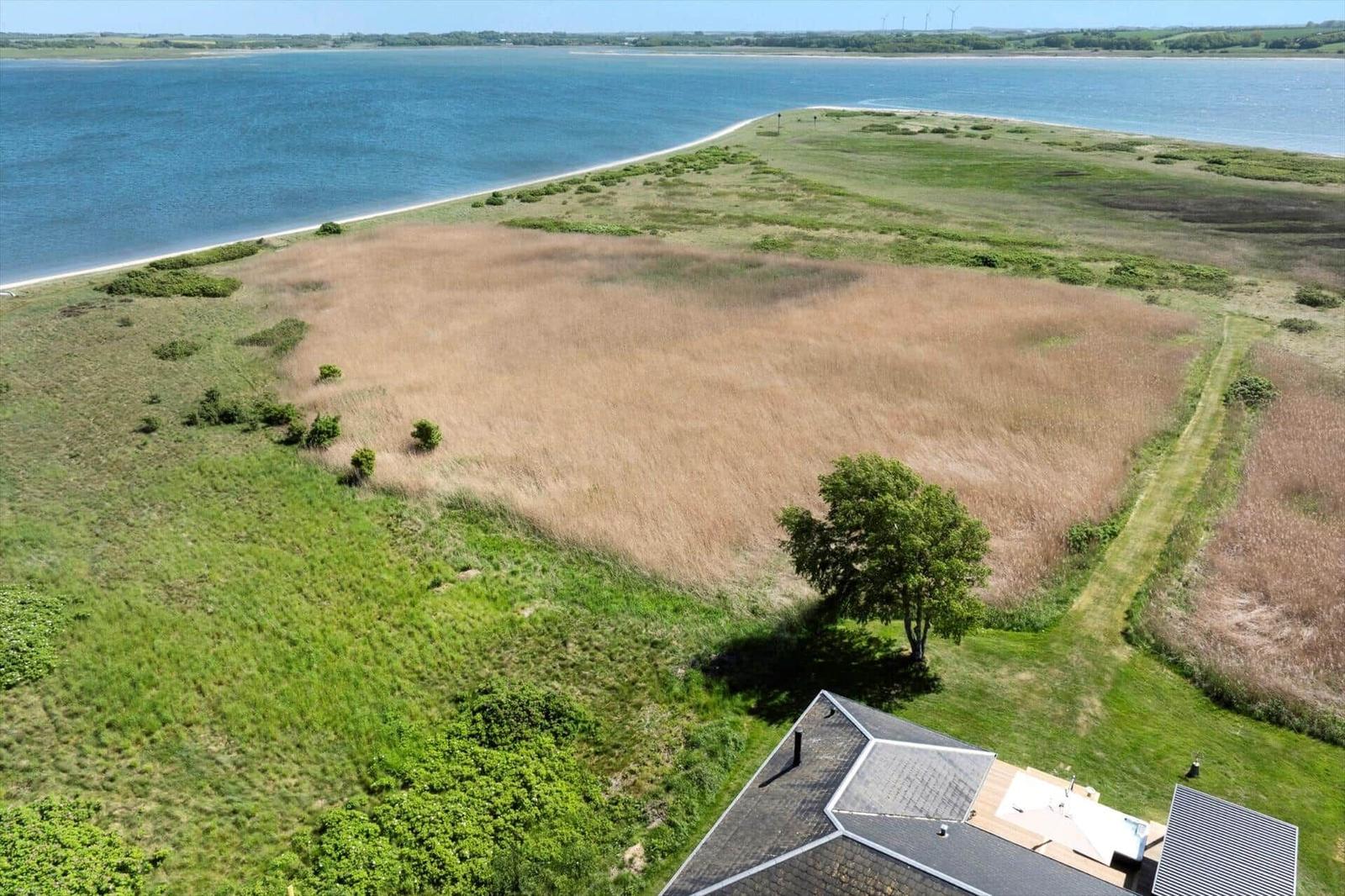 House with view of water and green areas