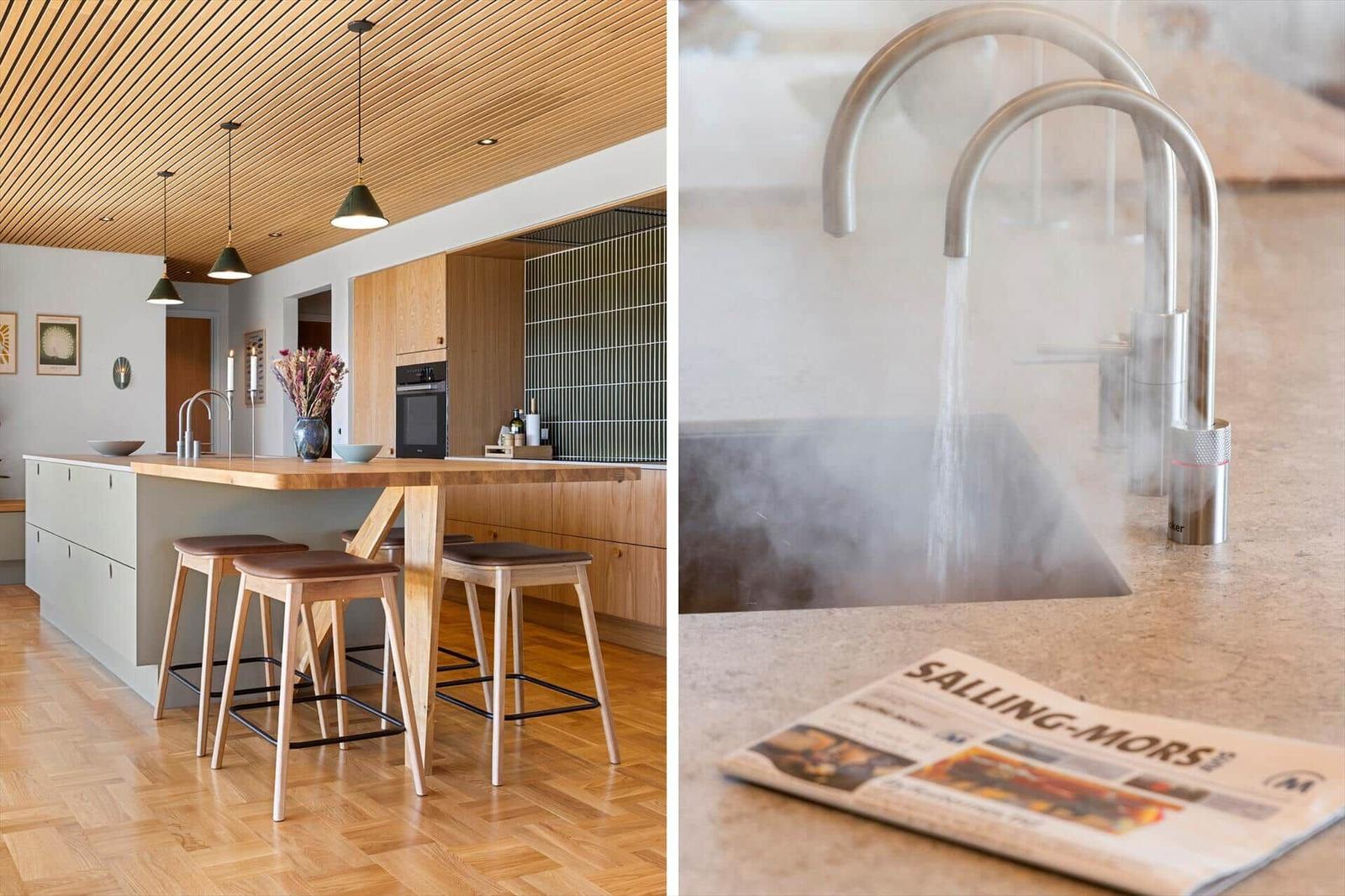 Kitchen with wooden countertop and integrated table. Water flows from modern faucet.