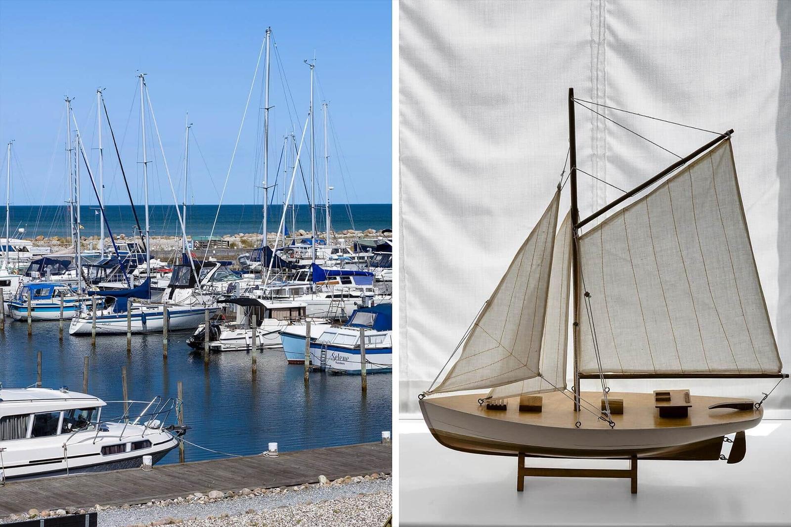 Marina with sailboats and model of a sailboat on a table.