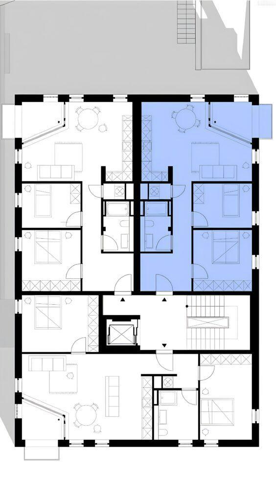 Floor plan showing layout with multiple rooms and staircases.