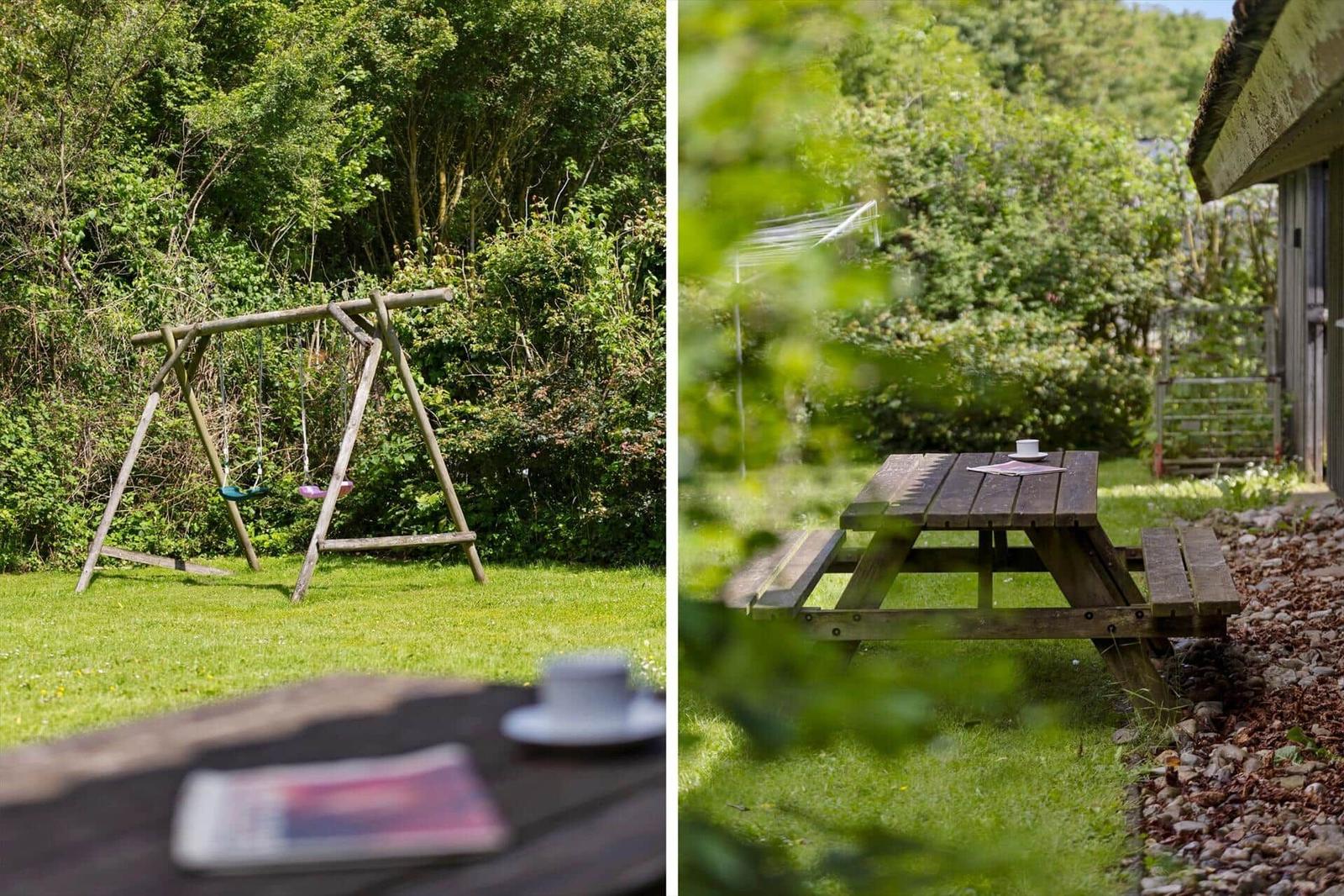 Backyard with picnic table and swing in green garden
