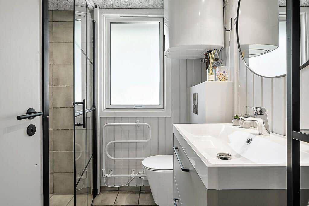 Bathroom with shower, toilet, and sink