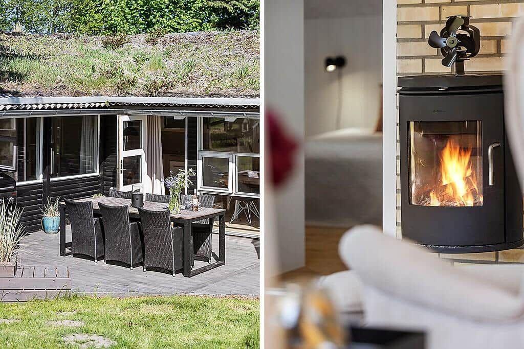 House with terrace and dining table. Inside, a wood-burning stove with a fire.