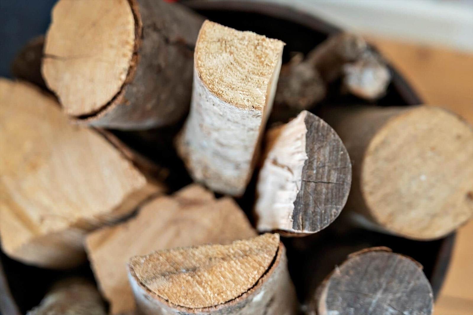 A basket with chopped firewood pieces.