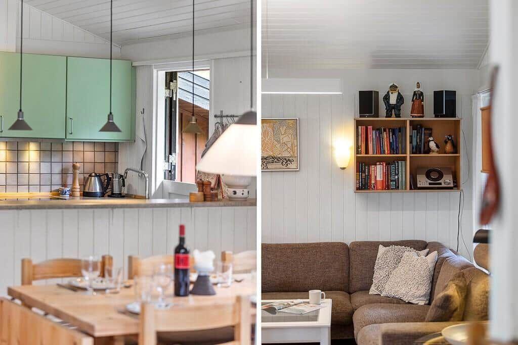 Kitchen with green cabinets and dining area. Living room with sofa, bookshelf, and wall lighting.