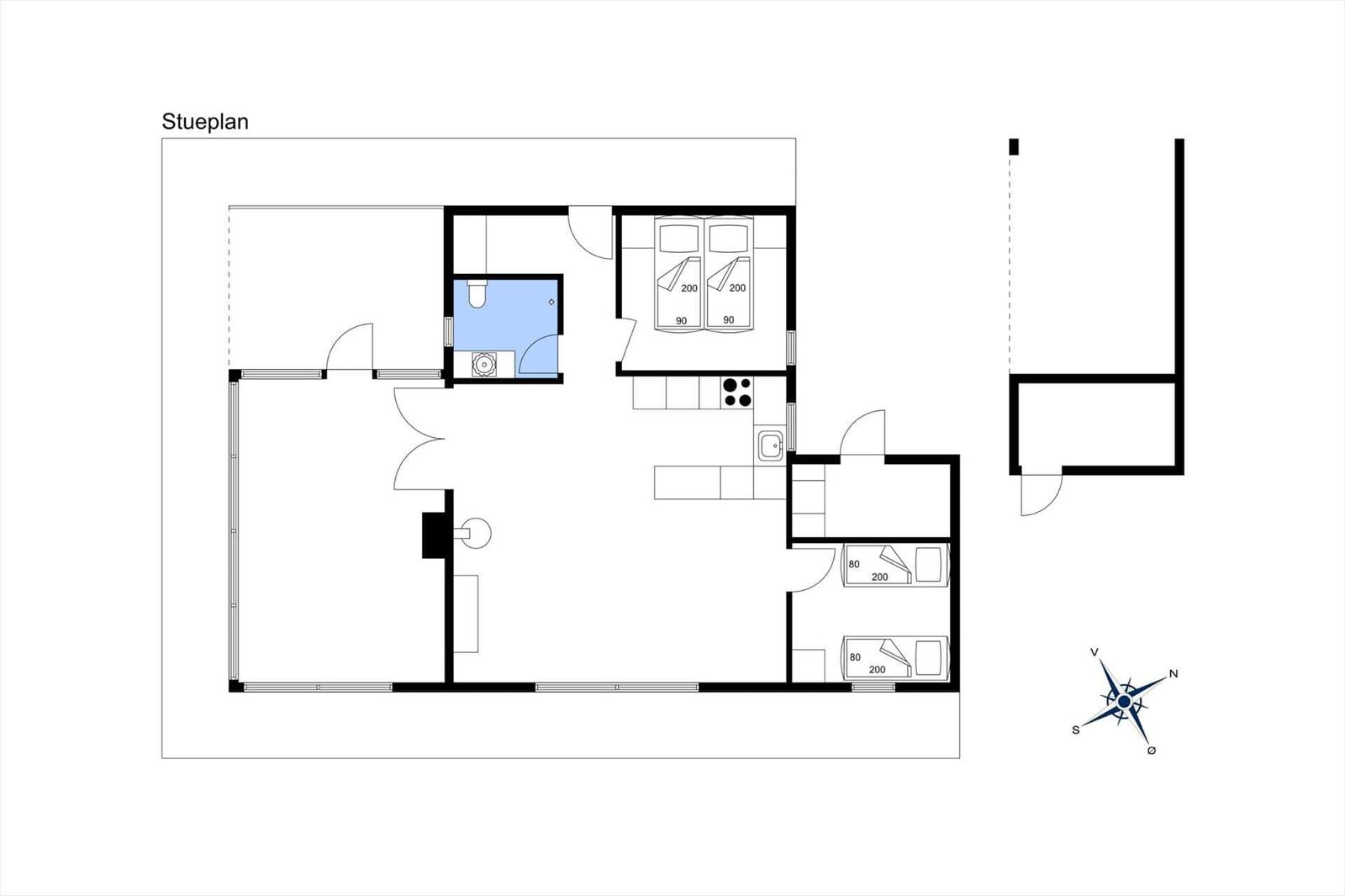 Stueplan zeigt Wohn- und Schlafzimmer, Küche, Bad und Terrasse mit Kompass.