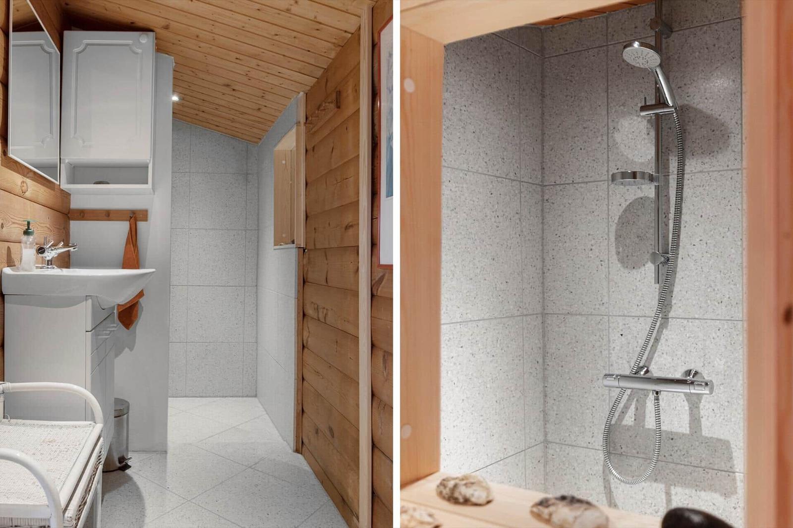 Bad mit Dusche und Waschbecken in Holzhaus