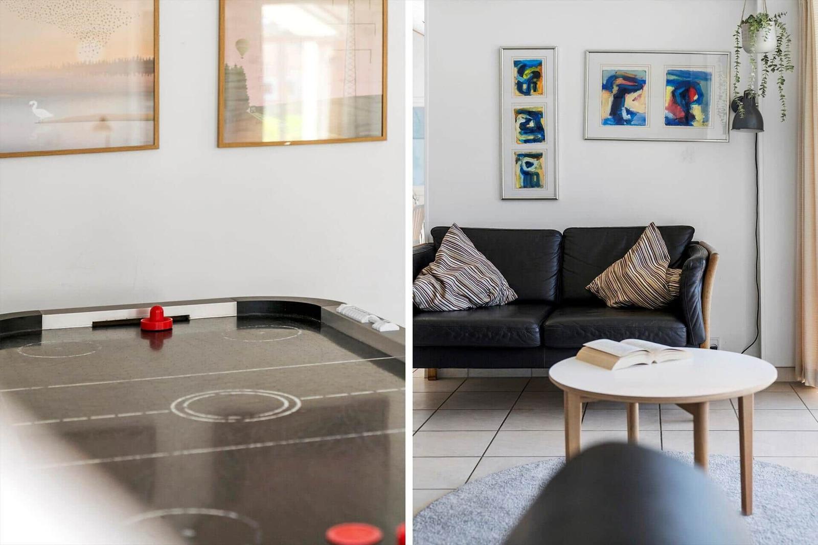 Left: Air hockey table. Right: Living room with sofa, coffee table, and wall art.