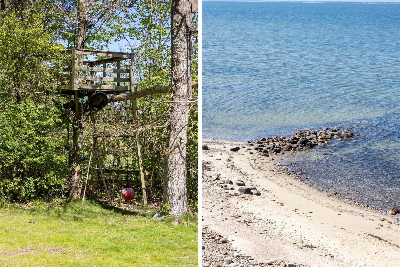 Wooden treehouse with swing in the woods. Shore with stones and sand by the water.