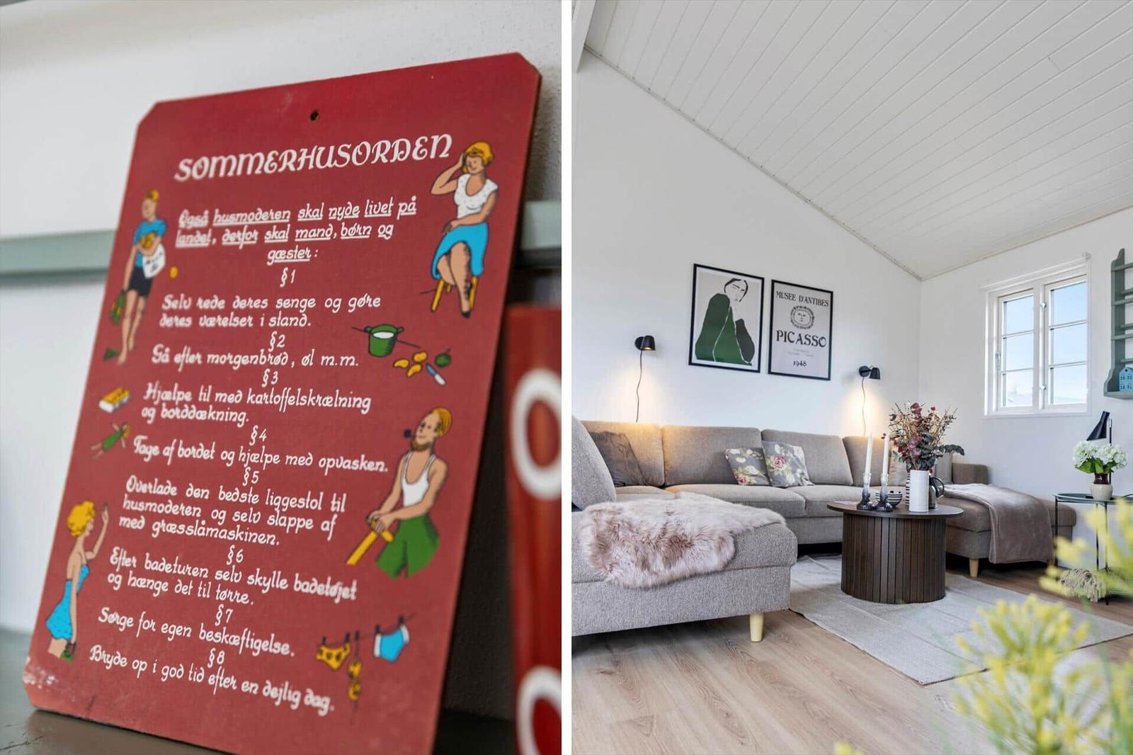 Ein Wohnzimmer mit Sofa, Tisch und Wandbildern. Ein Schild mit Hausordnung ist sichtbar.