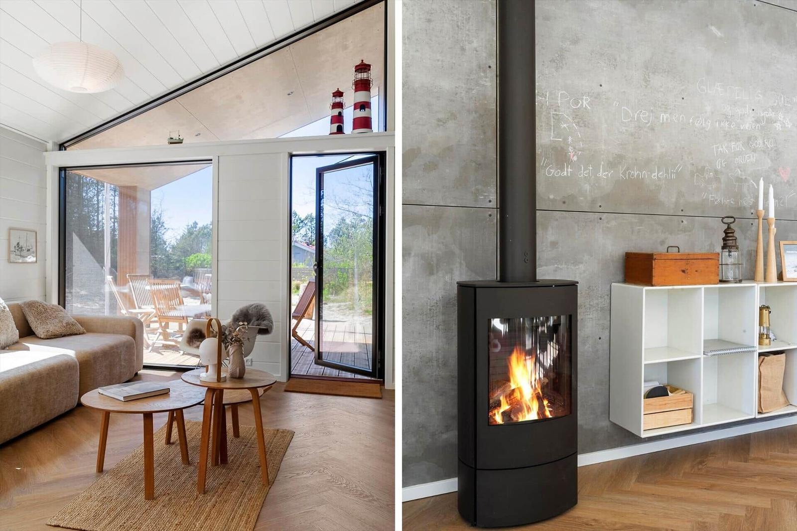 Living room with seating and view to terrace. Fireplace with burning fire against wall.
