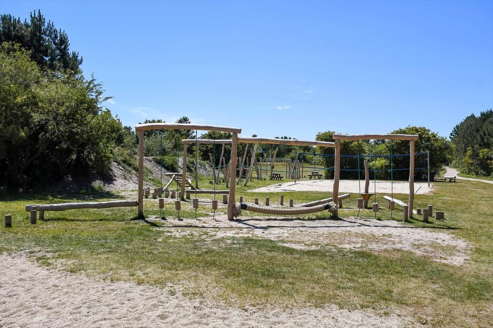 Deck with tables and chairs, view of the sea and boats.