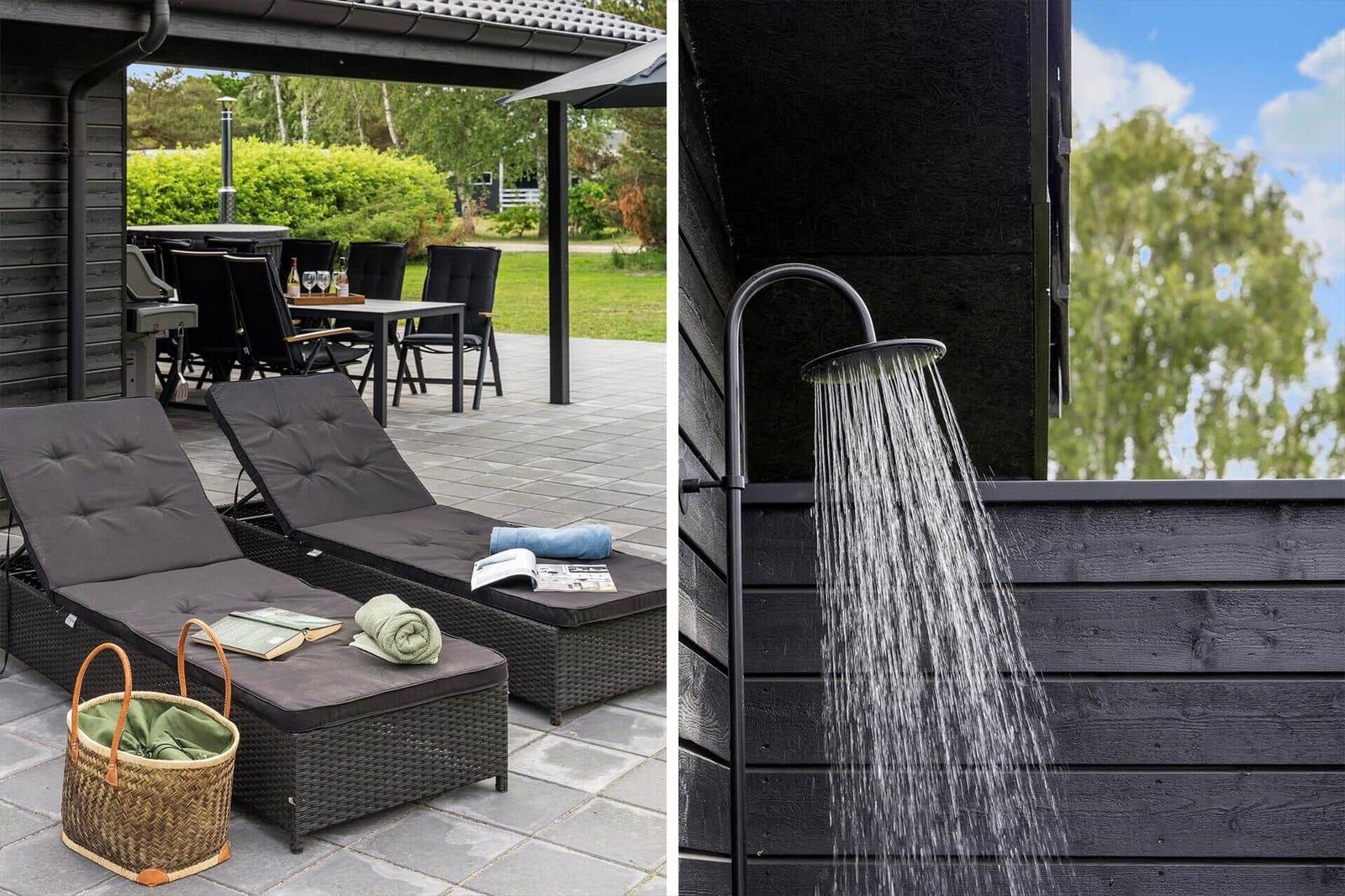 Outdoor area with loungers and grill. Outdoor shower against black wall.