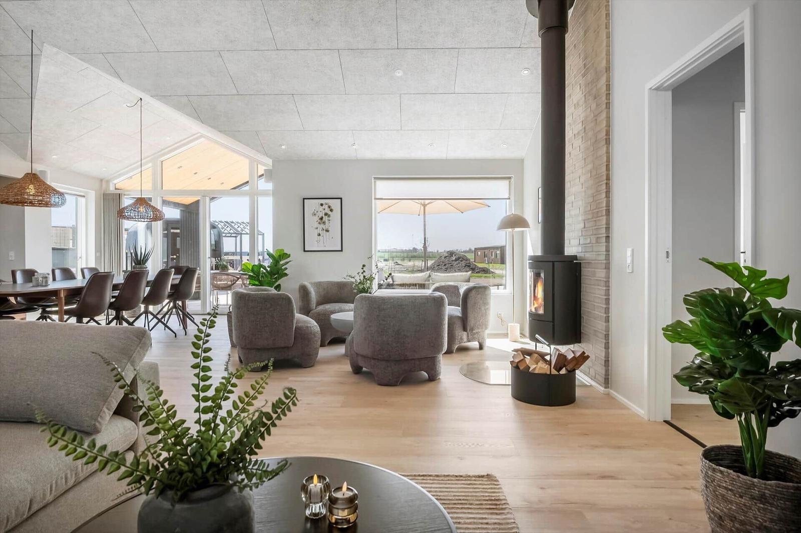Living area with seating, fireplace, and view to terrace