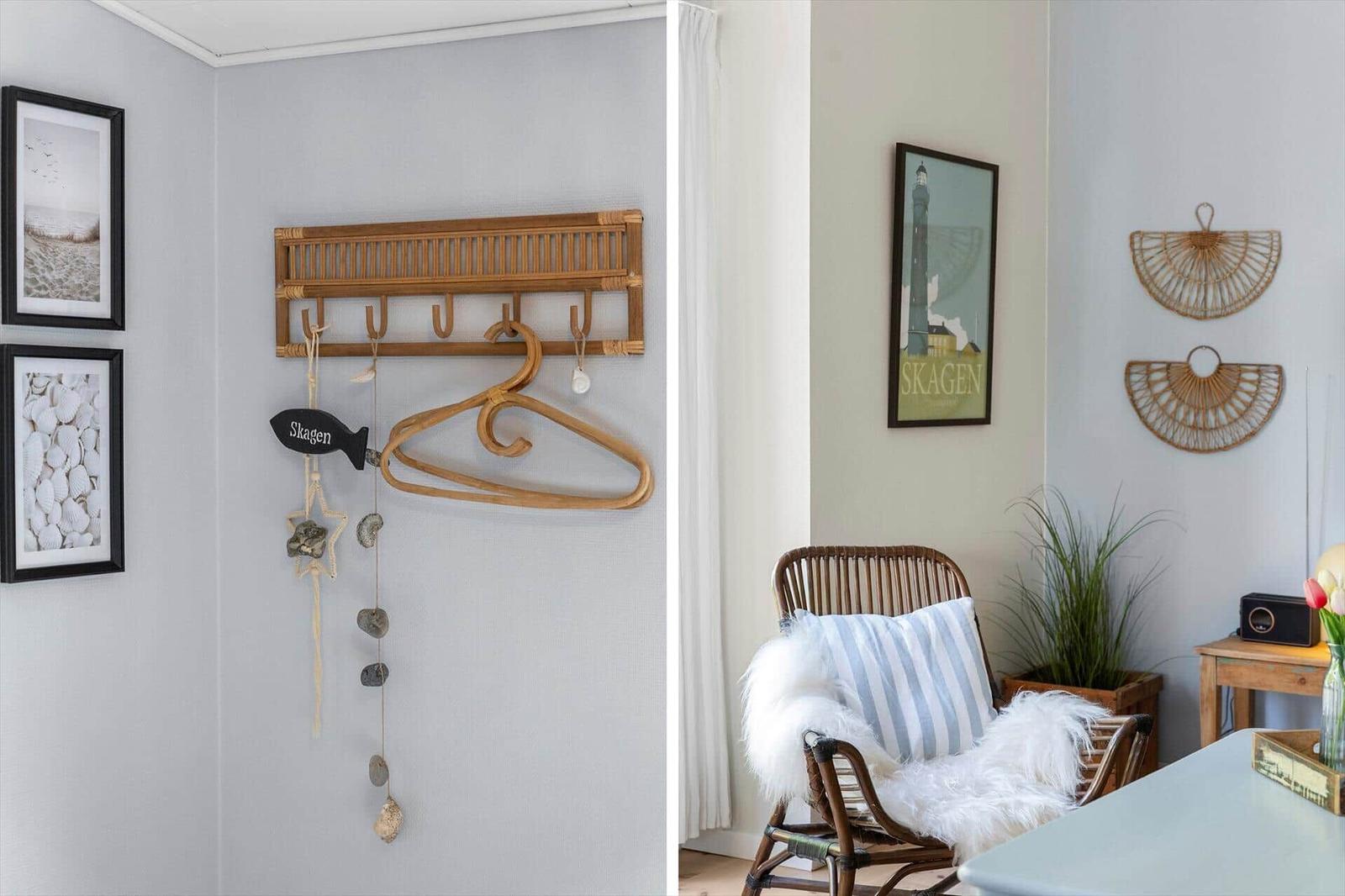 Wall rack with hooks and decor. Rattan chair with pillow and fur. Wall art and plant.