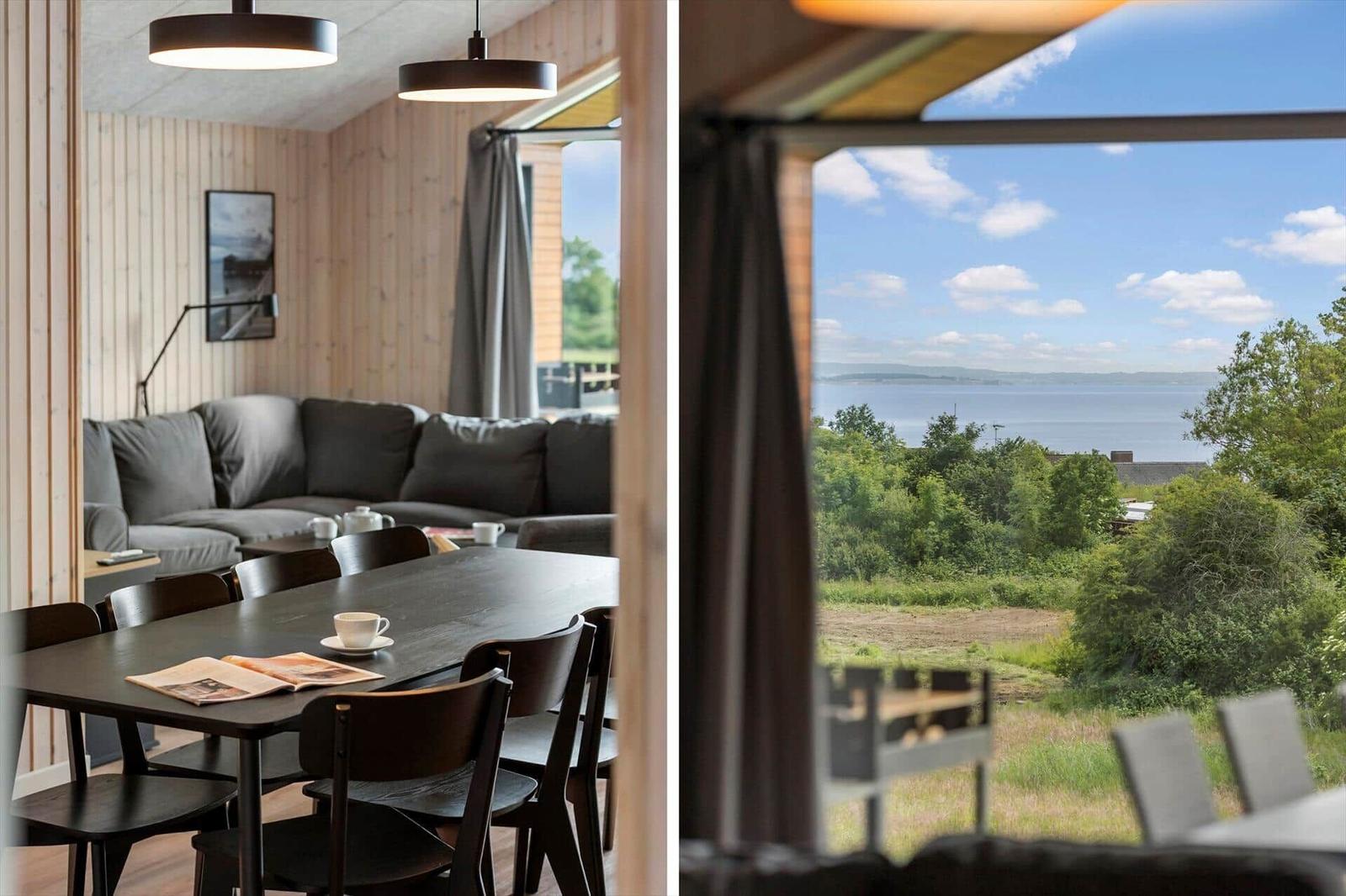 Dining area with sea view. Wooden walls, sofa and table.