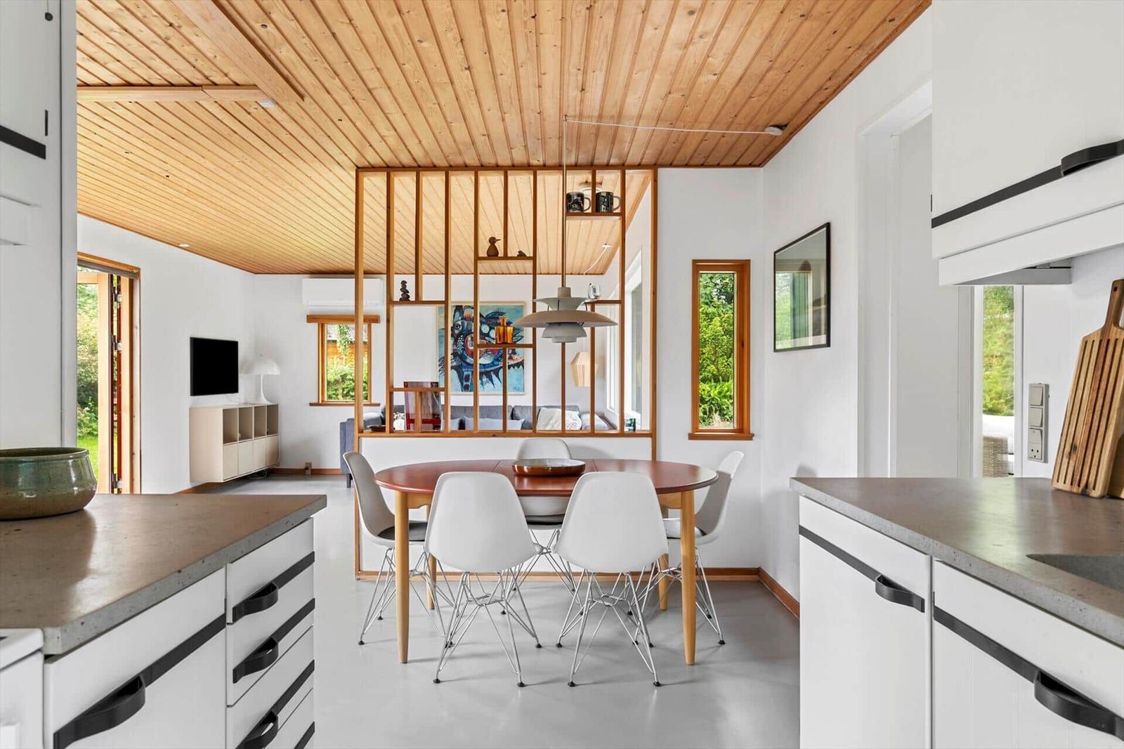 Kitchen with dining area and living room in background