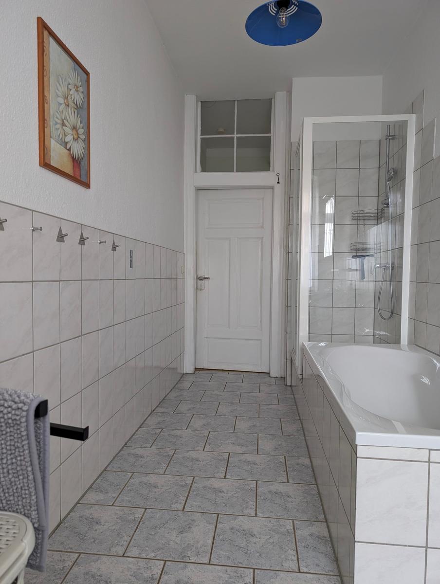 Bathroom with bathtub and shower